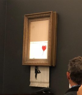 Obra de Banksy 'Menina com Balão' se transforma em ‘Amor está no lixo' após intervenção durante leilão de arte